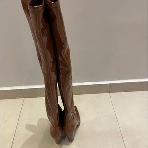 JLo thigh high heel boots